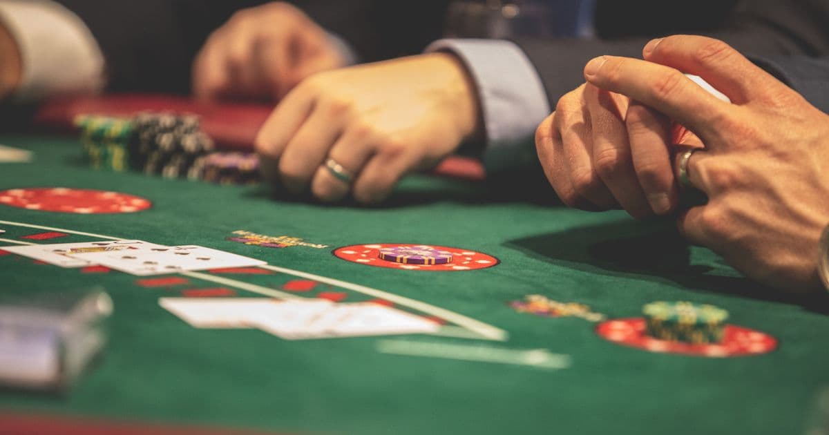 Casino chips and dice beside a laptop, comparing gambling and competitions