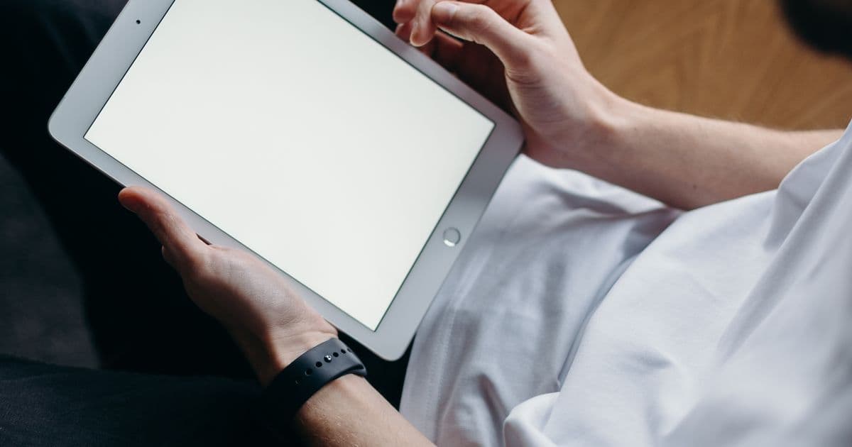 Person entering an online competition on a laptop at home